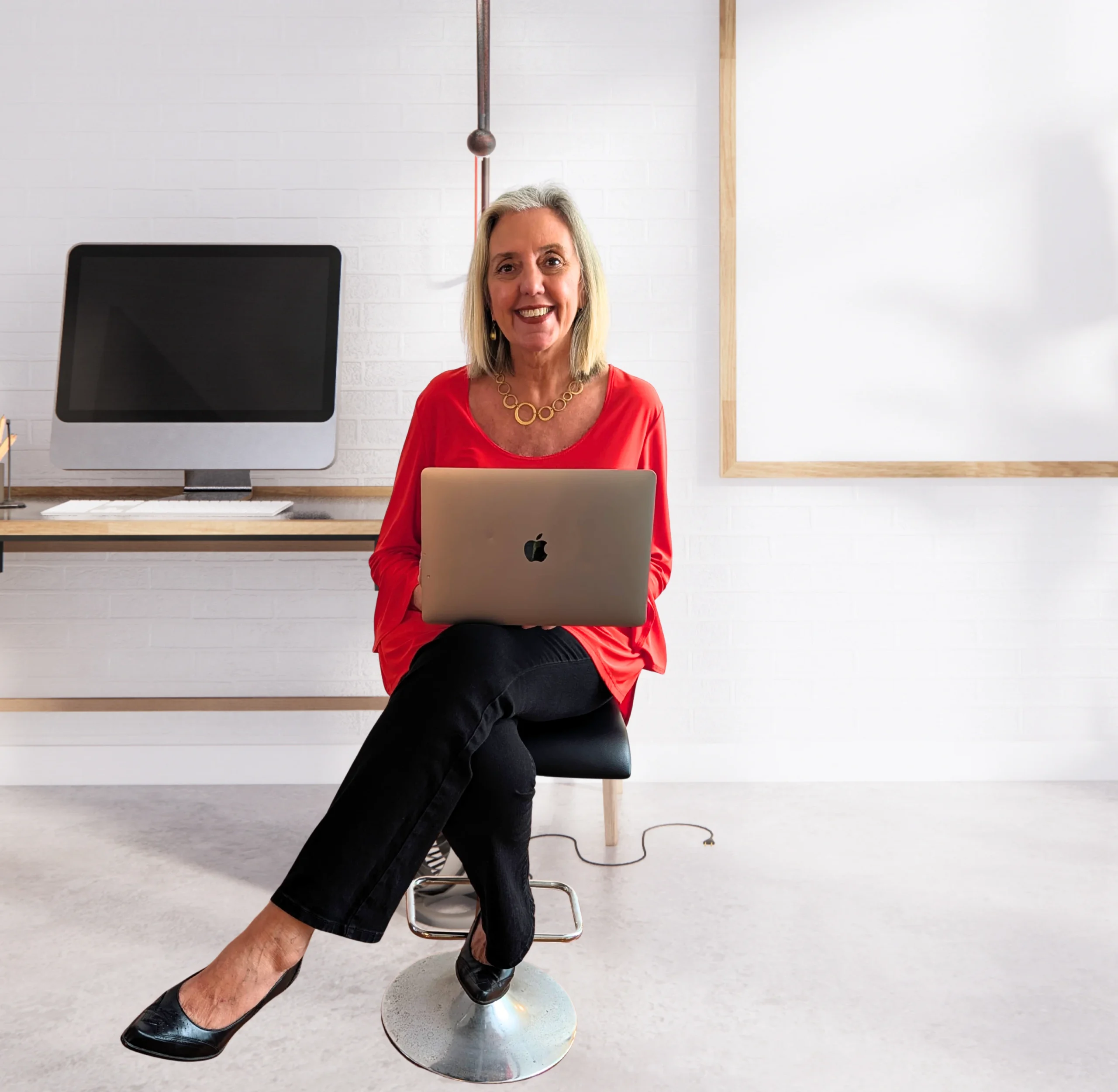 A happy, collaborative team at work in a bright modern office